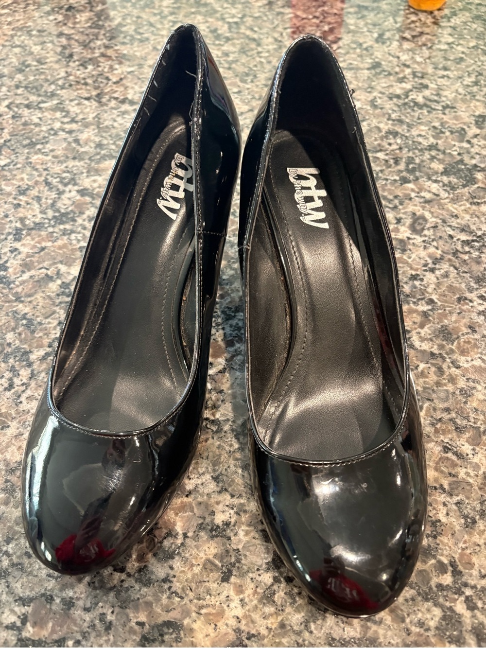 by the way. Black Patent Round-Toe Pumps